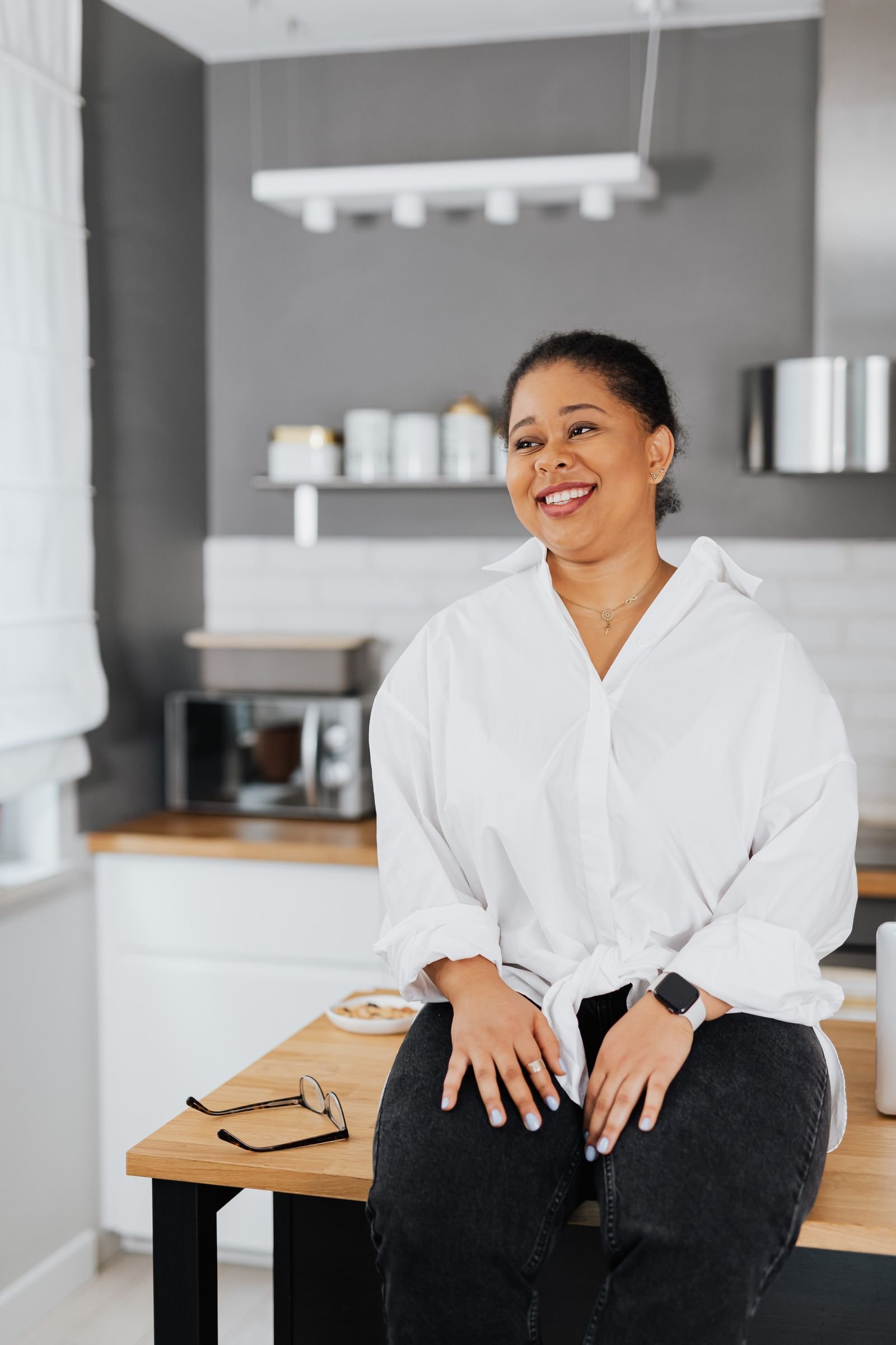 A smiling woman relaxing at home